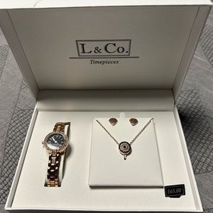 Brand new in box watch and necklace earring set. Beautiful rose tone .